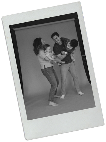 Colette Peri with her family, black and white studio portrait