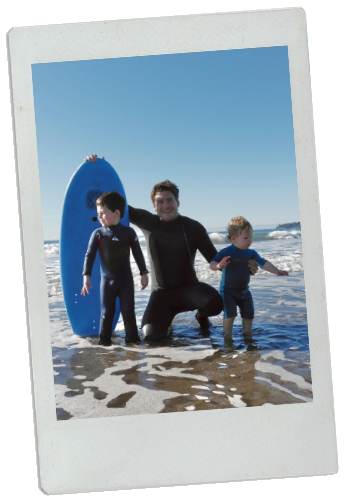 Colette's family surfing at the beach