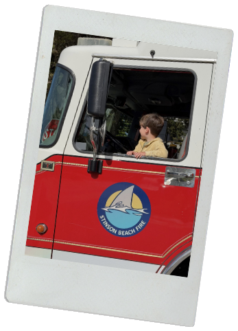 One of Colette's boys in a fire truck