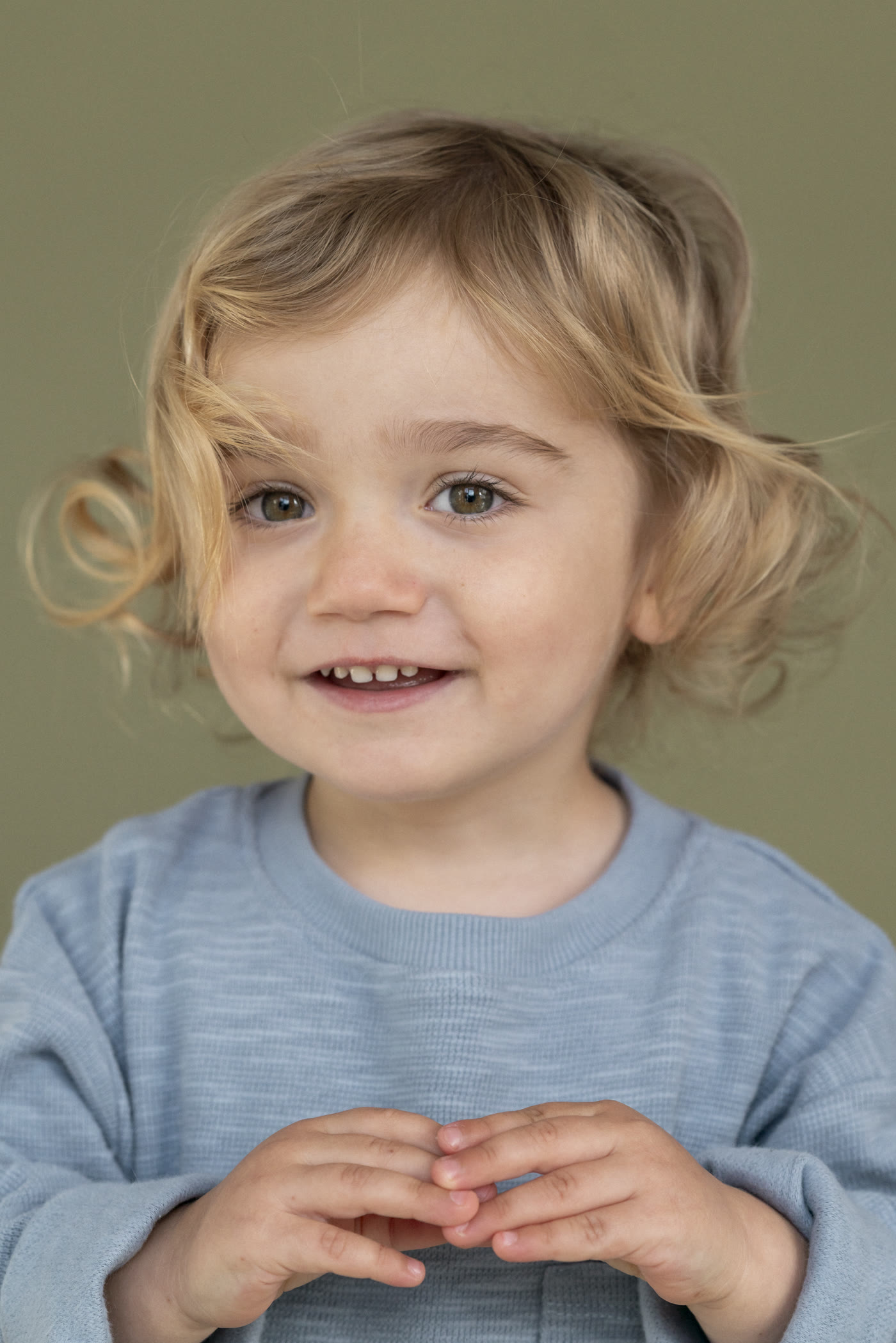 Kids personality portrait on a colored studio background by Colette Peri