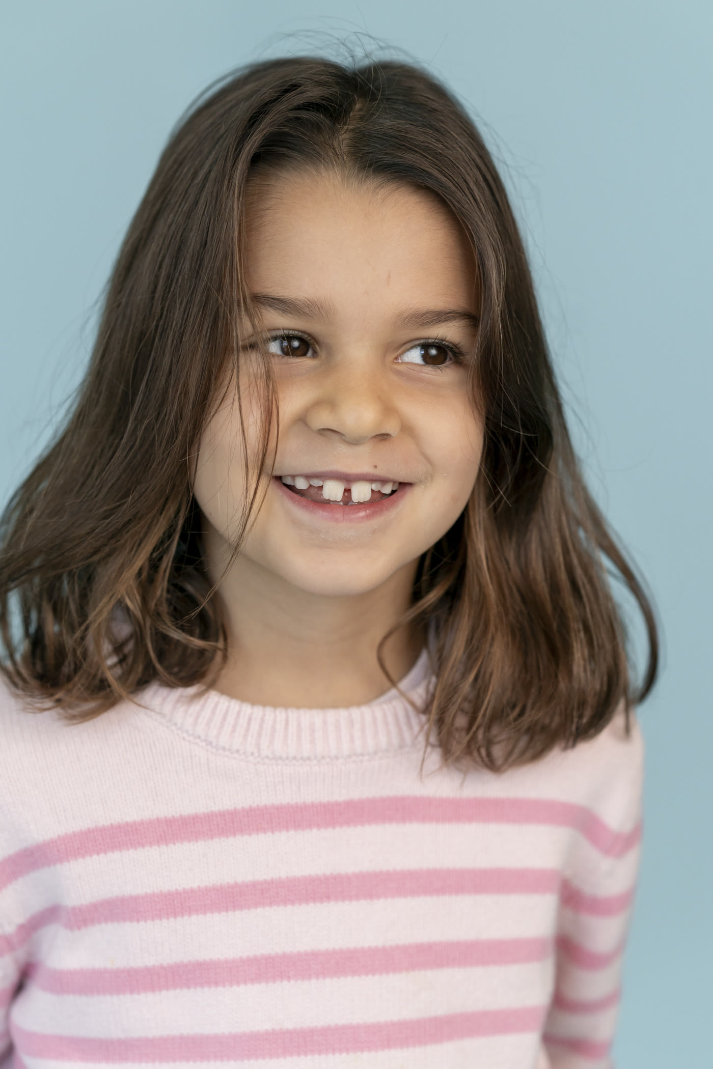 Kids personality portrait on a colored studio background by Colette Peri